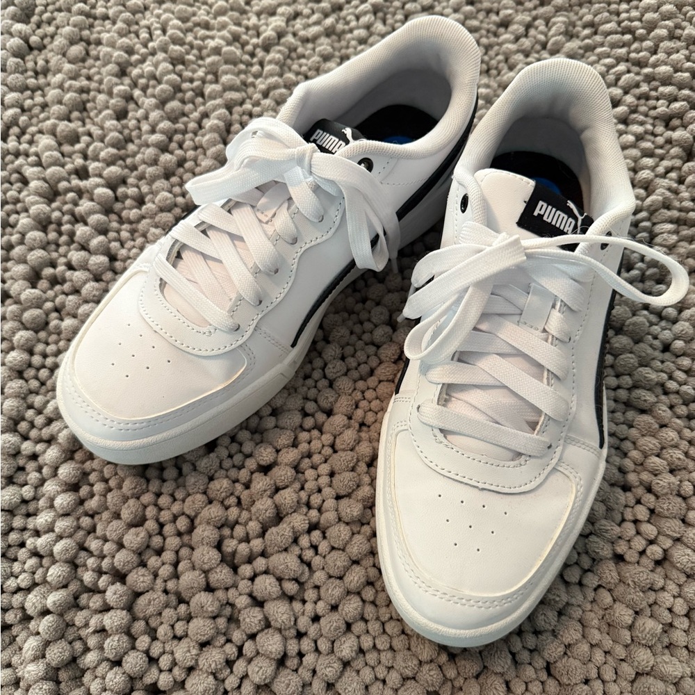 Puma women’s White and Black Sneakers
